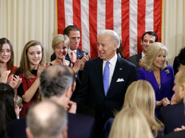 ice President Joe Biden, with his wife Jill Biden, celebrate after taking the oath of office from Supreme Court Justice Sonia Sotomayor surrounded by family during an official ceremony at the Naval Observatory, Sunday, Jan. 20, 2013, in Washington. Family members from left: Noami Biden, Finnegan Biden, Kathleen Biden, [...]</body></html>