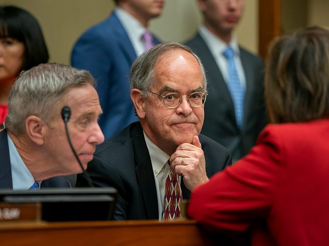 Rep. Jim Cooper, D-Tenn., center, joined at left by Rep. Stephen F. Lynch, D-Mass., confers with other Democrats as the House Oversight and Reform Committee considers whether to hold Attorney General William Barr and Commerce Secretary Wilbur Ross in contempt for failing to turn over subpoenaed documents related to the …