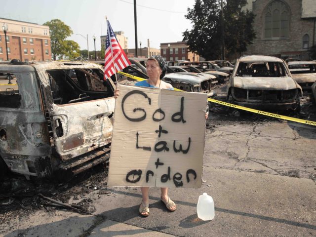 Kenosha riots afterman God and Law and Order (Scott Olson / Getty)