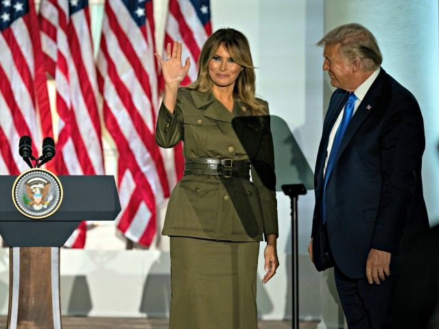 President Donald Trump joins first lady Melania Trump on stage after her speech to the 202