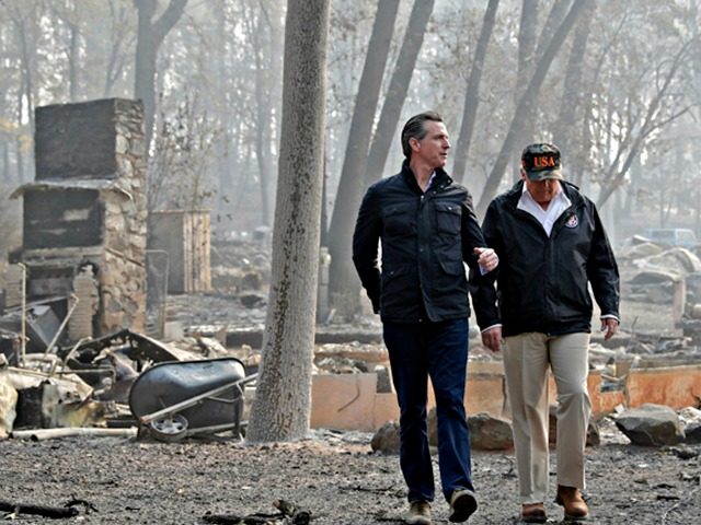 FILE - In this Nov. 17, 2018 file photo, President Donald Trump talks with California Gov.-elect Gavin Newsom, left, as California Gov. Jerry Brown, walks at right during a visit to a neighborhood destroyed by the Camp wildfire in Paradise, Calif. Gov. Gavin Newsom has said he wants to see …
