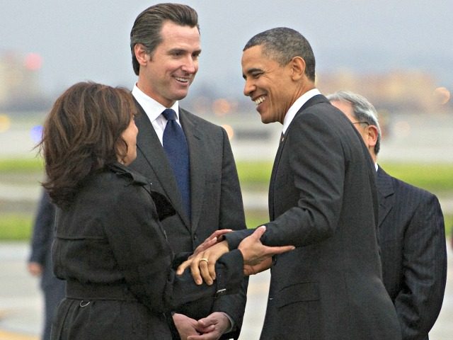 US President Barack Obama greets California Attorney General Kamala Harris (L) and Gavin Newsom, Lieutenant Governor of California, after arriving on Air Force One at San Francisco International Airport in San Francisco, California, February 17, 2011. Obama is traveling on a two-day trip to the West Coast, where he will …