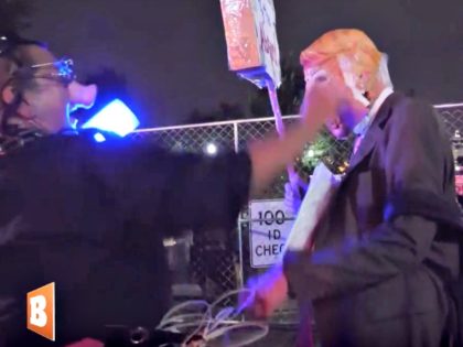 Person in Pig Mask Makes Trump Character Kneel