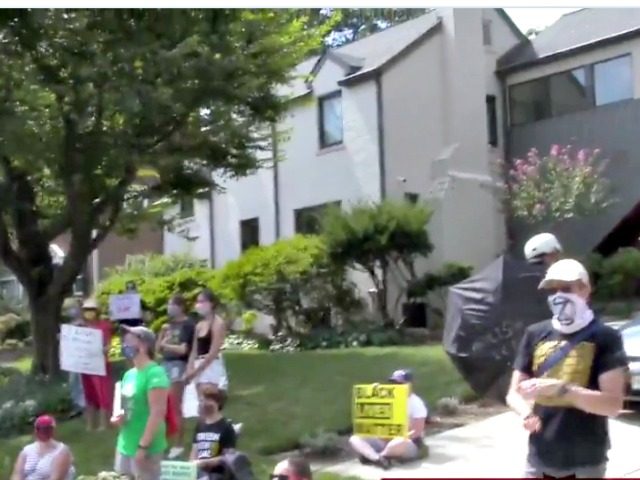 Protesters on Chad Wolf's Street