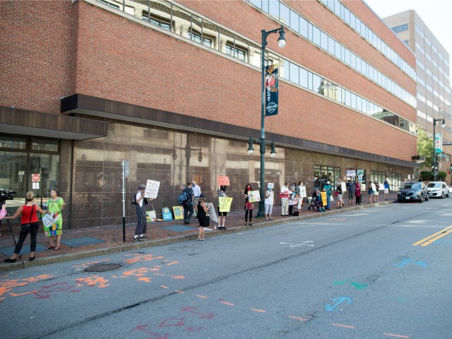 Rally goers gather outside a post office to protest the Trump administration's handling of the US Postal System at the Rally to Save the Post Office on August 22, 2020 in Portland, Maine. (Photo by Scott Eisen/Getty Images for MoveOn)