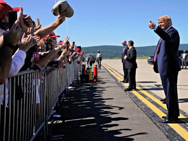 President Donald Trump gives a thumbs up to supporters after arriving at at Wilkes-Barre S