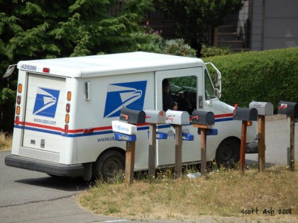 USPS truck near mailboxes