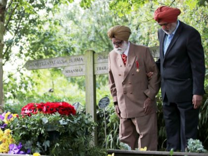ALREWAS, ENGLAND - AUGUST 15: World War Two veteran Darbara Singh Bhullar, 97, lays a wreath beside Prince Charles, Prince of Wales lays a wreath at the VJ Day National Remembrance event, held at the National Memorial Arboretum in Staffordshire, on August 15, 2020 in Alrewas, England. (Photo by Molly …