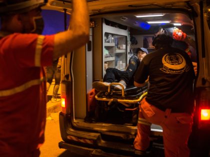 BEIRUT, LEBANON - AUGUST 09: An injured protestor is placed in an ambulance after he was h