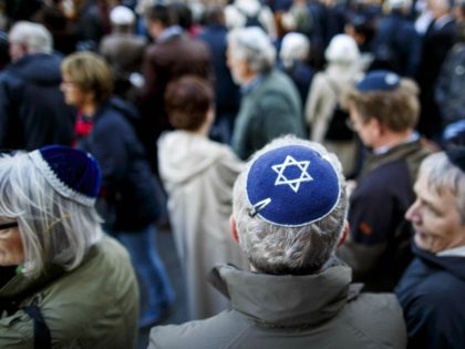 BERLIN, GERMANY - APRIL 25: Participants wearing a kippah during a "wear a kippah" gathering to protest against anti-Semitism in front of the Jewish Community House on April 25, 2018 in Berlin, Germany. The Jewish community made a public appeal for Jews and non-Jews to attend the event and wear …