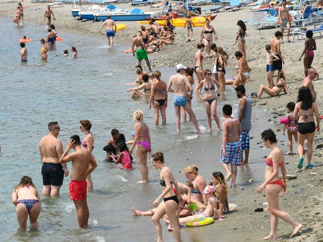 People enjoy beach activities on June 29, 2019 in Varazze, near Genoa. (Photo by Vincenzo PINTO / AFP) (Photo credit should read VINCENZO PINTO/AFP via Getty Images)