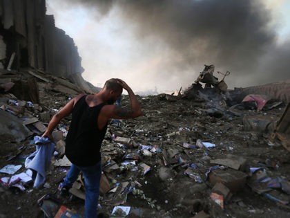 TOPSHOT - EDITORS NOTE: Graphic content / A picture shows the scene of an explosion at the