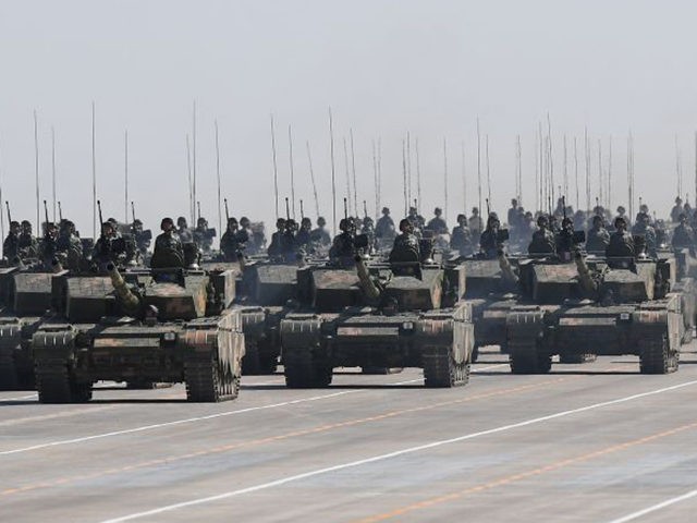 Chinese Type 99A tanks take part in a military parade at the Zhurihe training base in China's northern Inner Mongolia region on July 30, 2017. China held a parade of its armed forces on July 30 to mark the 90th anniversary of the People's Liberation Army (PLA) in a display …