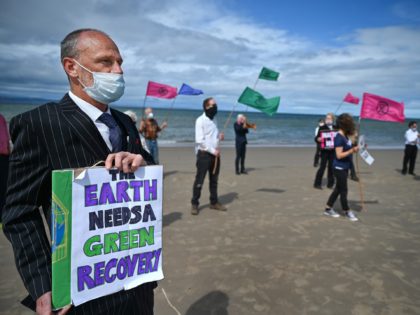 NAIRN, SCOTLAND - JULY 16: Members of Extinction Rebellion groups from Highland and Moray hold a demonstration on Central Beach on July 16, 2020 in Nairn, Scotland. Campaigners held a Heads in the Sand event to draw attention to a G20 meeting later this week. XR members think the G20 …