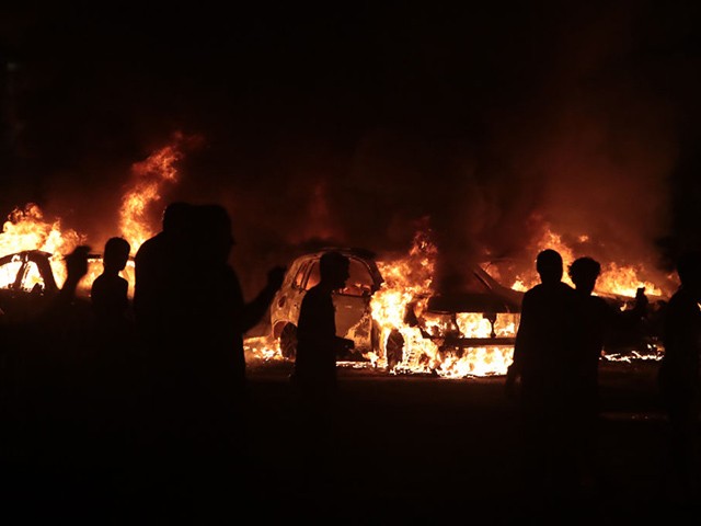 KENOSHA, WISCONSIN - AUGUST 24: Fires burn around downtown during a second night of rioting on August 24, 2020 in Kenosha, Wisconsin. Rioting as well as clashes between police and protesters began Sunday night after a police officer shot Jacob Blake 7 times in the back in front of his three children. (Photo by Scott Olson/Getty Images)
