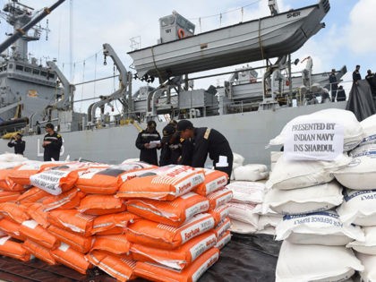 Indian Navy troops offload emergency supplies from the Indian ship Shardul at Colombo harbour in Colombo on May 28, 2017. Emergency teams rushed to distribute aid on May 28 to half a million Sri Lankans displaced after the island's worst flooding in more than a decade claimed 126 lives and …