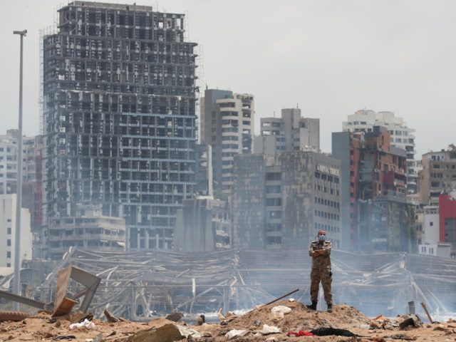 A soldier stands at the devastated site of the explosion in the port of Beirut, Lebanon, T