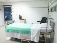 Empty made-up hospital bed