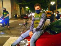 An alleged arsonist was outed by his grandmother in online review for the riot gear