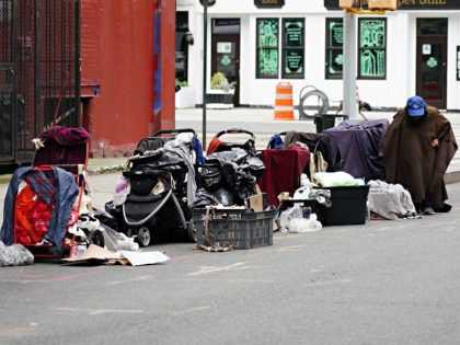 NEW YORK, NEW YORK - MAY 24: A homeless person sits with their belongings on the street during the coronavirus pandemic on May 24, 2020 in New York City. COVID-19 has spread to most countries around the world, claiming over 343,000 lives with over 5.3 million infections reported. (Photo by …