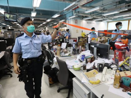 HONG KONG, CHINA - AUGUST 10: A handout photo from Apple Daily showing police officers dur