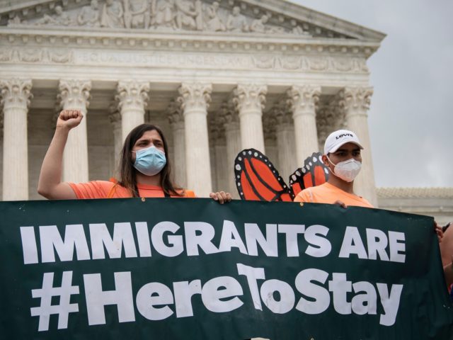 WASHINGTON, DC - JUNE 18: DACA recipients and their supporters rally outside the U.S. Supreme Court on June 18, 2020 in Washington, DC. On Thursday morning, the Supreme Court, in a 5-4 decision, denied the Trump administration's attempt to end DACA, the Deferred Action for Childhood Arrivals program. (Photo by …