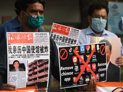 Members of the Working Journalist of India (WJI) hold placards urging citizens to remove Chinese apps and stop using Chinese products during a demonstration against the Chinese newspaper Global Times, in New Delhi on June 30, 2020. - TikTok on June 30 denied sharing information on Indian users with the …