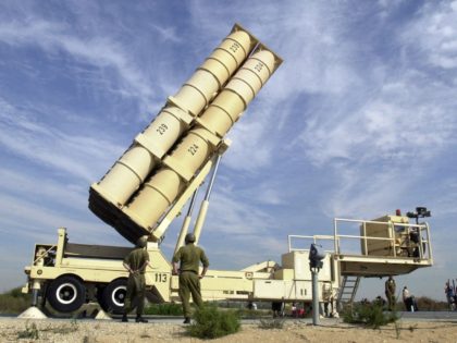 Israeli soldiers demonstrate the operation of the Arrow anti-missile mobile launcher at th