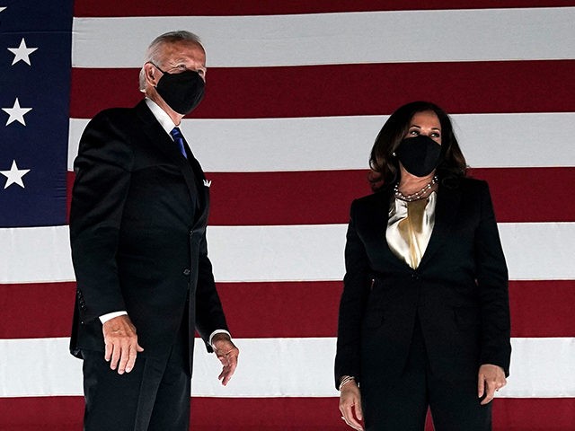 TOPSHOT - Former vice-president and Democratic presidential nominee Joe Biden (L) and Senator from California and Democratic vice presidential nominee Kamala Harris greet supporters outside the Chase Center in Wilmington, Delaware, at the conclusion of the Democratic National Convention, held virtually amid the novel coronavirus pandemic, on August 20, 2020. …