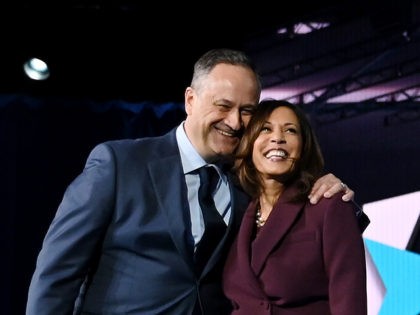 TOPSHOT - Senator from California and Democratic vice presidential nominee Kamala Harris and her husband Douglas Emhoff stand on stage at the end of the third day of the Democratic National Convention, being held virtually amid the novel coronavirus pandemic, at the Chase Center in Wilmington, Delaware on August 19, …