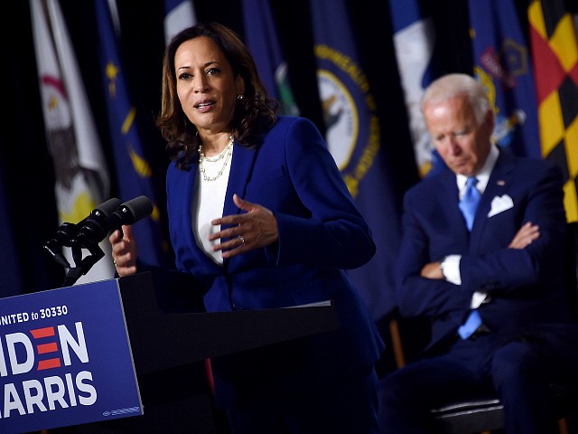 Democratic presidential nominee and former US Vice President Joe Biden listen to his vice presidential running mate, US Senator Kamala Harris, speak during their first press conference together in Wilmington, Delaware, on August 12, 2020. (Photo by Olivier DOULIERY / AFP) (Photo by OLIVIER DOULIERY/AFP via Getty Images)