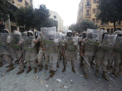 BEIRUT, LEBANON - AUGUST 08: Soldiers stand with shields during anti-government protests o