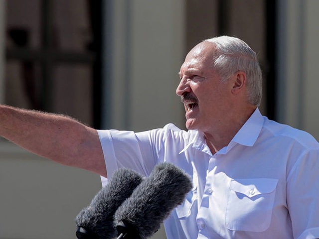 Belarus' President Alexander Lukashenko gestures as he delivers a speech during a rally he