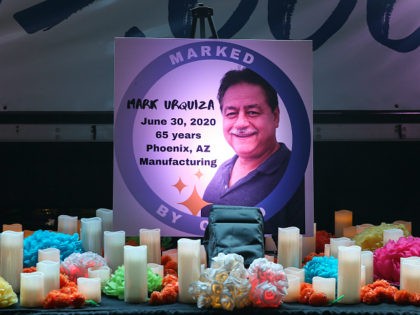 WASHINGTON, DC - AUGUST 13: A poster memorializing Mark Urquiza is displayed on a altar bu