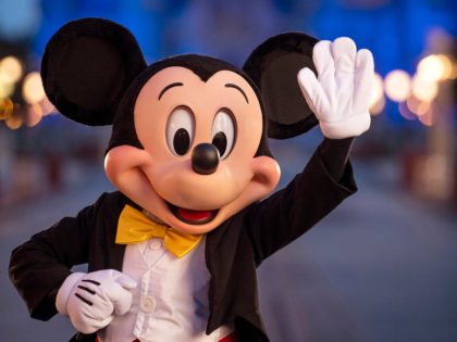 LAKE BUENA VISTA, FL - JULY 11: In this handout photo provided by Walt Disney World Resort, Mickey Mouse pauses on Main Street, U.S.A. just before sunrise at Walt Disney World Resort on July 11, 2020 in Lake Buena Vista, Florida. (Photo by Kent Phillips/Walt Disney World Resort via Getty …
