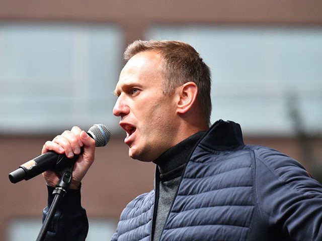 Russian opposition leader Alexei Navalny gestures as he delivers a speech during a demonst