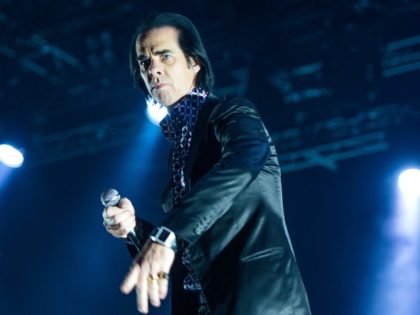 Australian singer and musician Nick Cave and the Bad Seeds perform on stage on the last day of the Lowlands music festival in Biddinghuizen, on August 18, 2013. AFP PHOTO/ANP/ FERDY DAMMAN netherlands out (Photo credit should read Ferdy Damman/AFP via Getty Images)