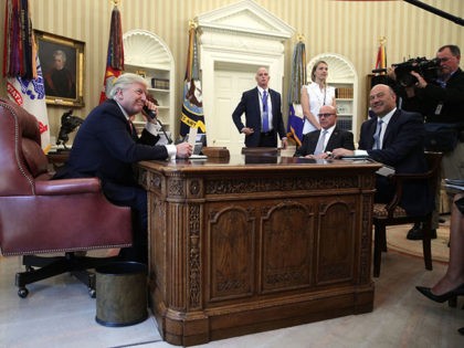 WASHINGTON, DC - JUNE 27: U.S. President Donald Trump (L) speaks on the phone with Irish Prime Minister Leo Varadkar on the phone as National Economic Council Director Gary Cohn (R) and National Security Adviser H. R. McMaster (2nd R) look on in the Oval Office of the White House …