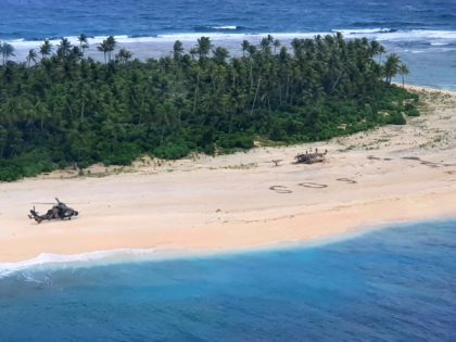 In this photo provided by the Australian Defence Force, an Australian Army helicopter lands on Pikelot Island in the Federated States of Micronesia, where three men were found, Sunday, Aug. 2, 2020, safe and healthy after missing for three days. The men were missing in the Micronesia archipelago east of …