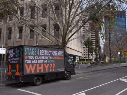A sign on a truck warns people to stay home in Melbourne on August 5, 2020, as the city enforces strict lockdown restrictions after a fresh outbreak of the COVID-19 coronavirus. - Australia's worst-hit state of Victoria reported 725 new cases and 15 coronavirus deaths on August 5, including a …