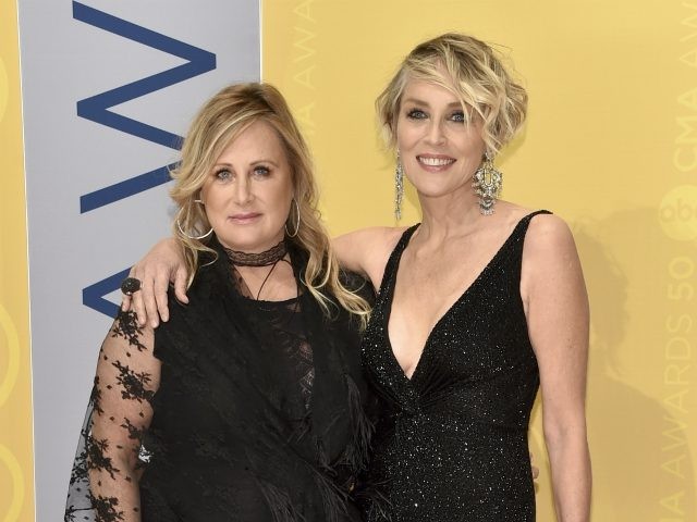 Kelly Stone, left, and Sharon Stone arrive at the 50th annual CMA Awards at the Bridgeston