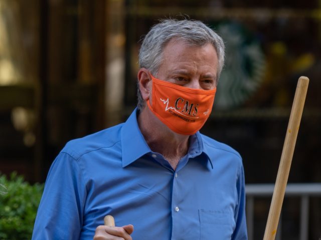 NEW YORK, NY - JULY 09: New York City Mayor Bill de Blasio, his wife Chirlane McCray and Rev. Al Sharpton help paint a Black Lives Matter mural on Fifth Avenue directly in front of Trump Tower on July 9, 2020 in New York City. In a tweet, President Trump …