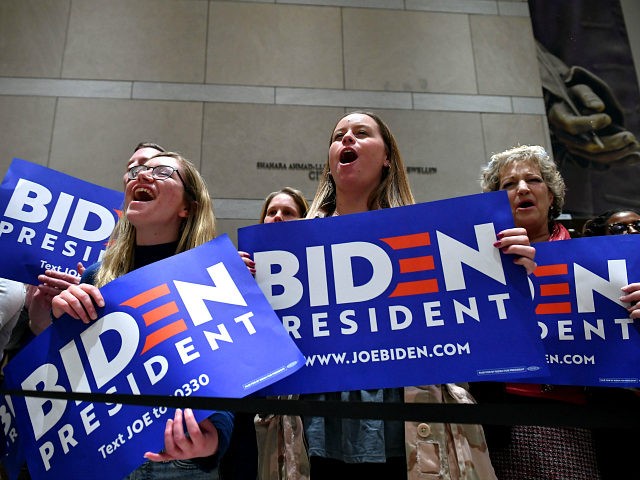Supporters of Democratic presidential hopeful former Vice President Joe Biden cheers as he speaks, flanked by his wife Jill Biden, at the National Constitution Center in Philadelphia, Pennsylvania on March 10, 2020. (Photo by Mandel NGAN / AFP) (Photo by MANDEL NGAN/AFP via Getty Images)