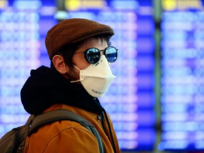 A man wearing a protective mask walks at the Terminal 1 of El Prat airport in Barcelona on March 16, 2020. - After the COVID-19 pandemic began in China late last year, Europe in recent weeks emerged as the biggest flashpoint and the death toll on the continent surged over …