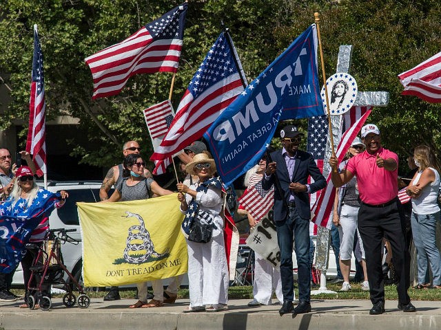 Supporters of the US president hold a rally to call for the reopening of the California economy after the lockdown closure, implemented to stop the spread of the novel coronavirus (which causes Covid-19), in Woodland Hills, California, on May 16, 2020. (Photo by Mark RALSTON / AFP) (Photo by MARK …