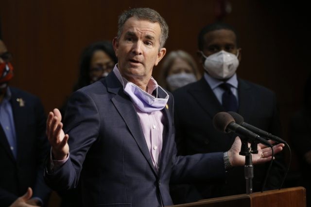 In this June 4, 2020, file photo Virginia Gov. Ralph Northam speaks during a news conference in Richmond, Va. Virginia has rolled out a smartphone app to automatically notify people if they might have been exposed to the coronavirus. It's the first U.S. state to use new pandemic technology created …