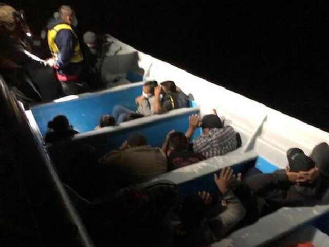 CBP Marine Interdiction vessel crew members apprehend 15 illegal aliens in a boat off the coast of San Diego. (U.S. Customs and Border Protection)