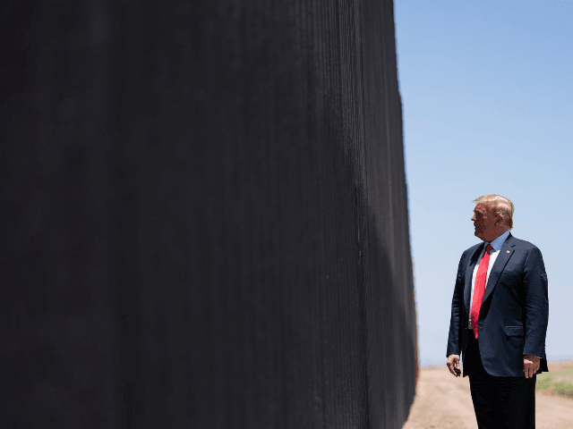 President Donald Trump tours a section of the border wall, Tuesday, June 23, 2020, in San