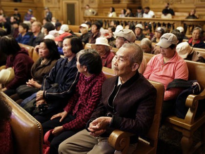 People listen during a Board of Supervisors meeting about the location of recreational cannabis stores at City Hall, Monday, Nov. 13, 2017, in San Francisco. The path toward legalizing recreational cannabis in weed-friendly San Francisco has taken a surprisingly contentious turn as critics, who are largely older Chinese American immigrants …
