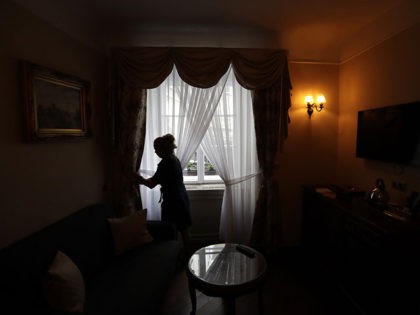 A housekeeper prepares a room for customers at a hotel in Prague, Czech Republic, Monday, May 25, 2020. The bars, restaurants and cafes are returning to full service in the Czech Republic as the government is taking further steps to ease its restrictive measures adopted to contain the coronavirus pandemic. …